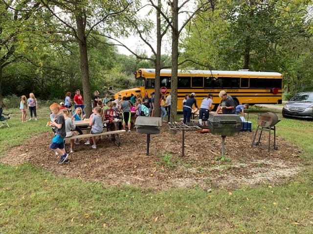 1st Photo: 5th grade class from Cole Elementary School learning about the benefits of composting.